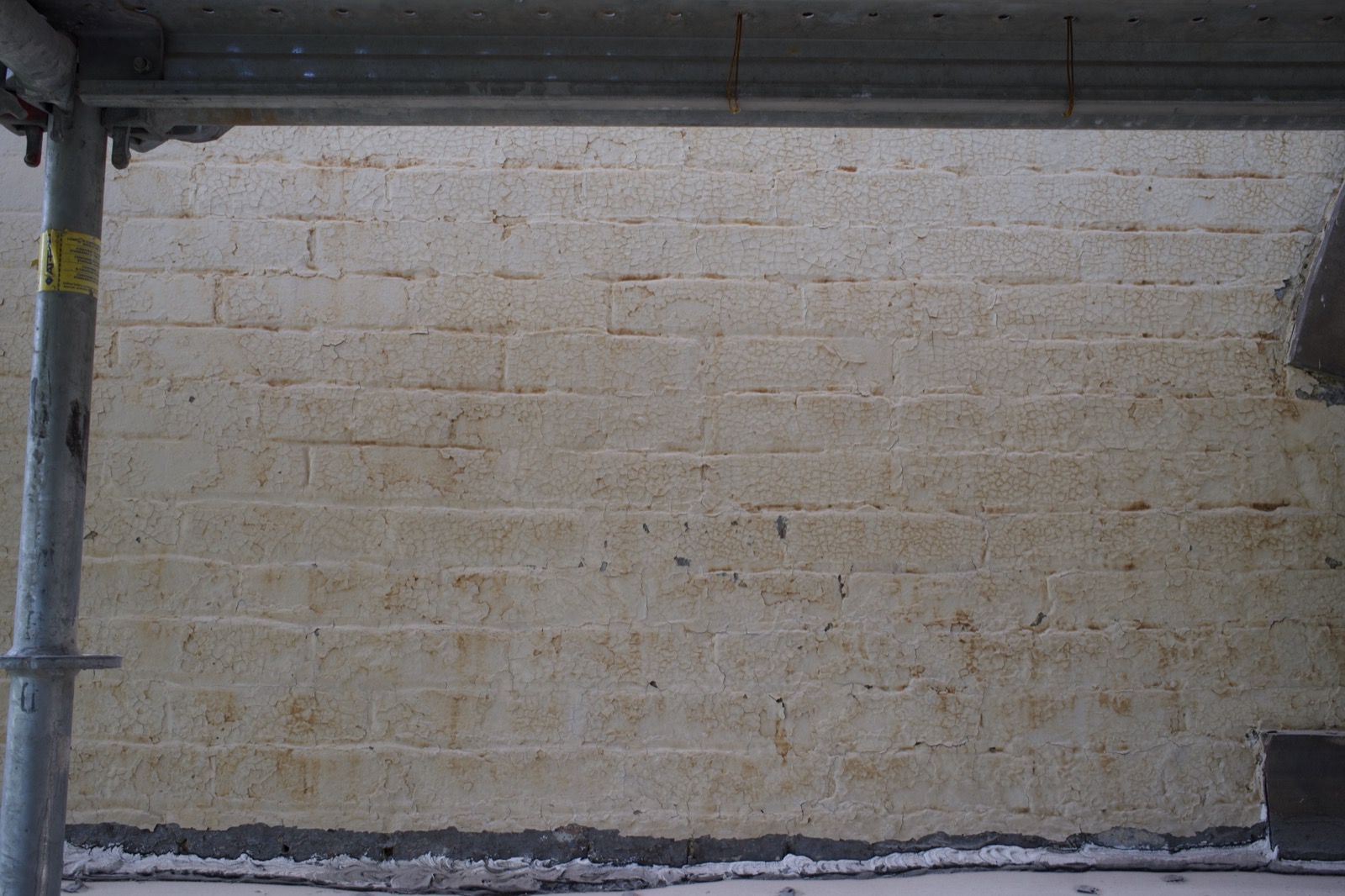 Layers of paint on the brick at Clayton before removal, Point Breeze, Pittsburgh