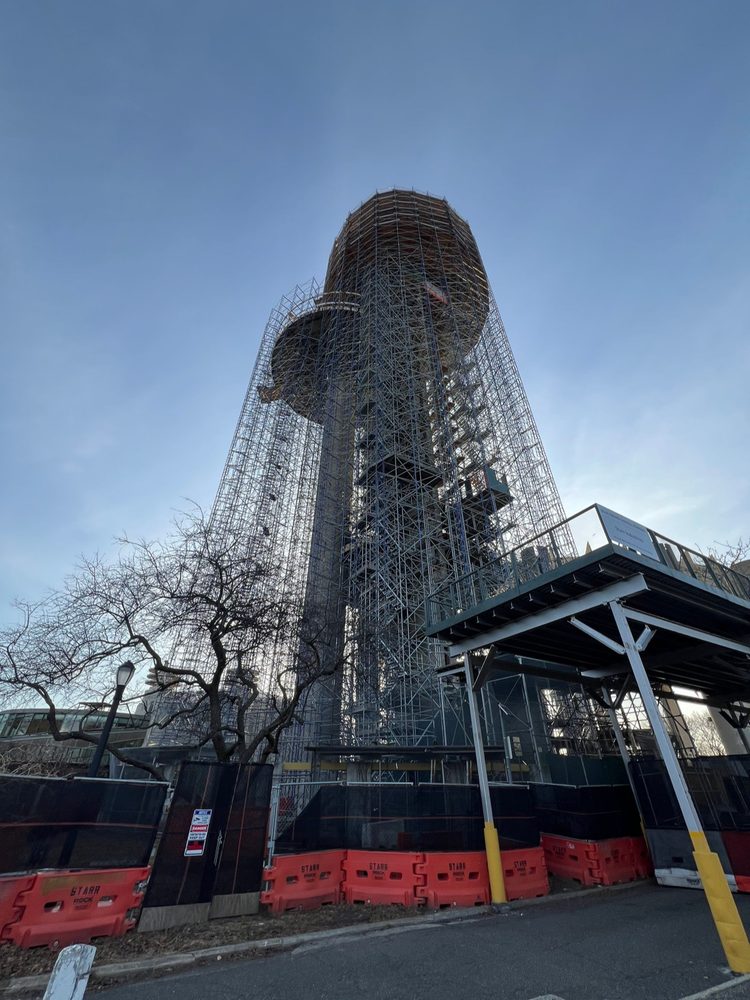 New York State Pavilion observation tower wrapped in scaffold at Flushing Meadows-Corona Park