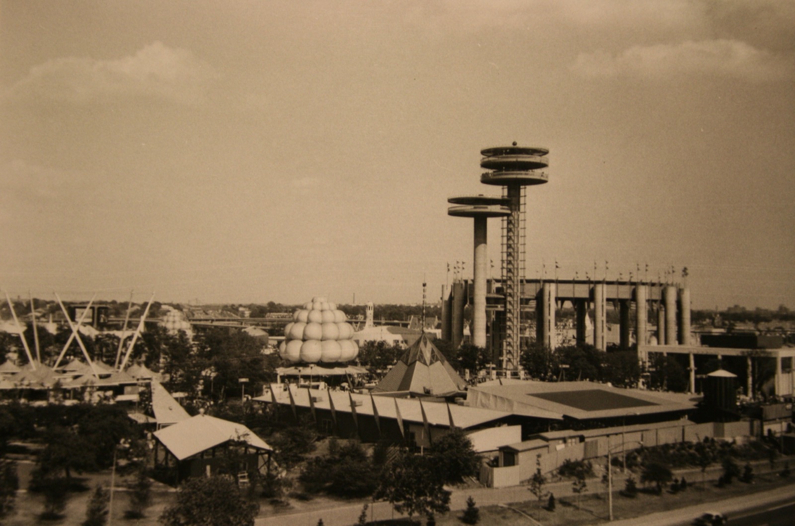Archival photograph of the New York State Pavilion during the 1964-65 World's Fair, observation towers at right
