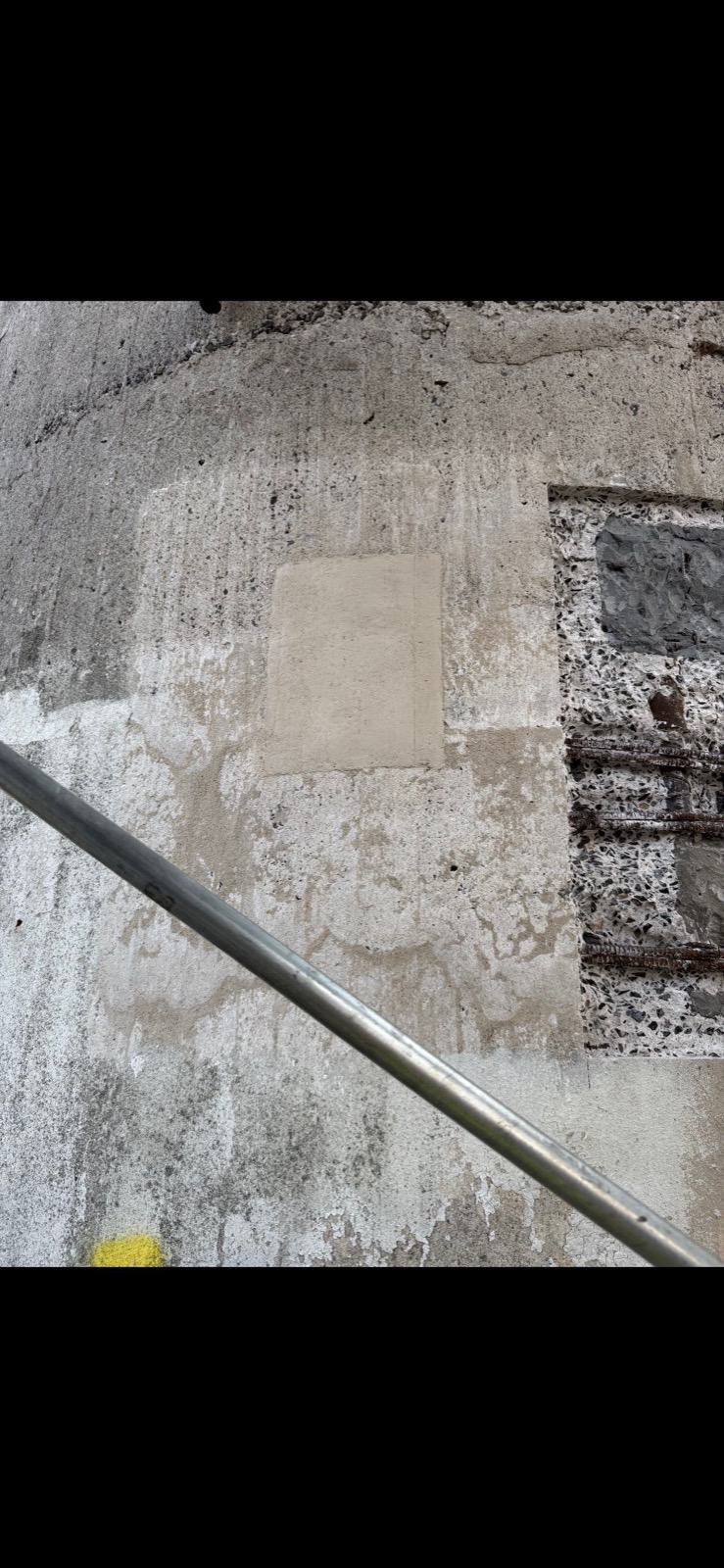 Completed patch mockup on the concrete tower wall at the New York State Pavilion observation towers